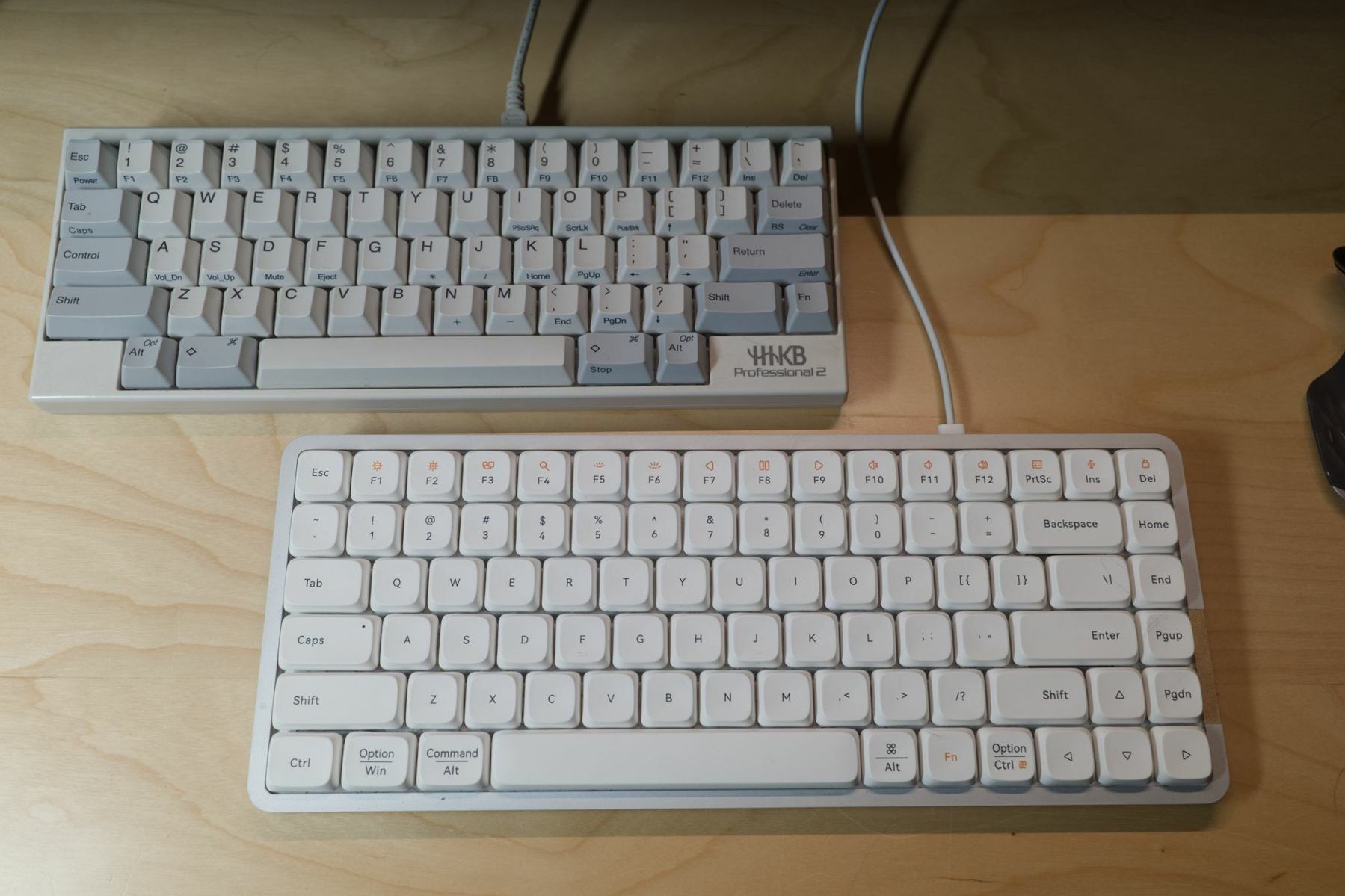 HHKB and Lofree keyboards on desk.